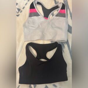 2 girls sports bras. Black lined with Pink, fits size 5 white with pink grey bla